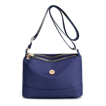 Minimalistisk axel- och crossbodyväska i nylon med stor kapacitet