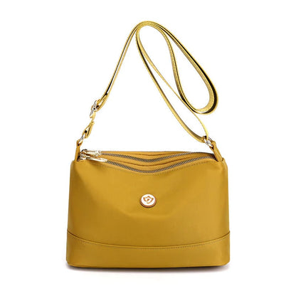 Minimalistisk axel- och crossbodyväska i nylon med stor kapacitet